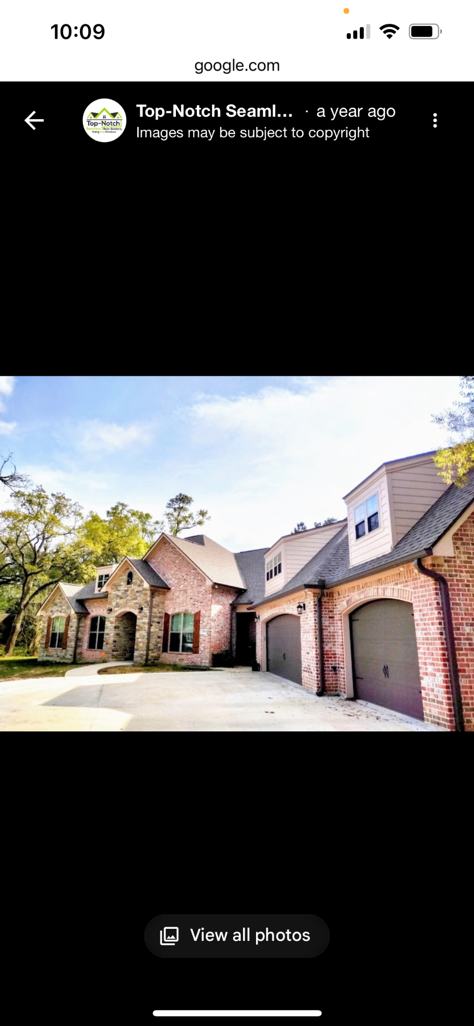 Beautiful brick home with completed gutter and siding work